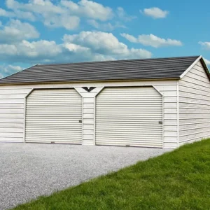 A 24X30X9 Vertical Roof Metal Garage with two doors in the middle of a grassy field.