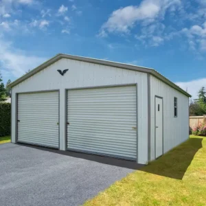 A 24X30X9 Vertical Roof Metal Garage in a backyard with a vertical roof and a garage door.