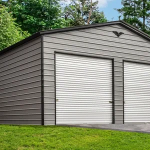 A 26X40X12 Vertical Roof Metal Garage with two doors and a grassy yard.