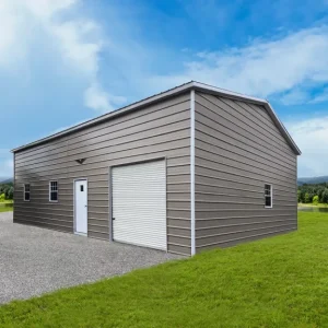 A 28X40X13 Vertical Roof Metal Garage with a vertical roof and a garage door in the middle of a grassy field.