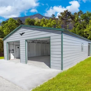 A 28X40X9 Vertical Roof Metal Garage in a grassy area.