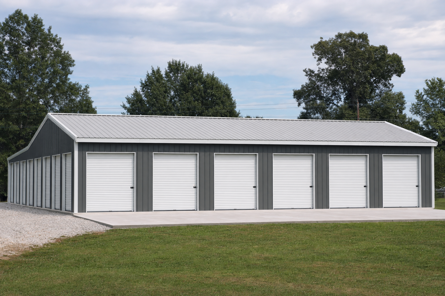 Large metal storage facility with multiple white roll-up doors