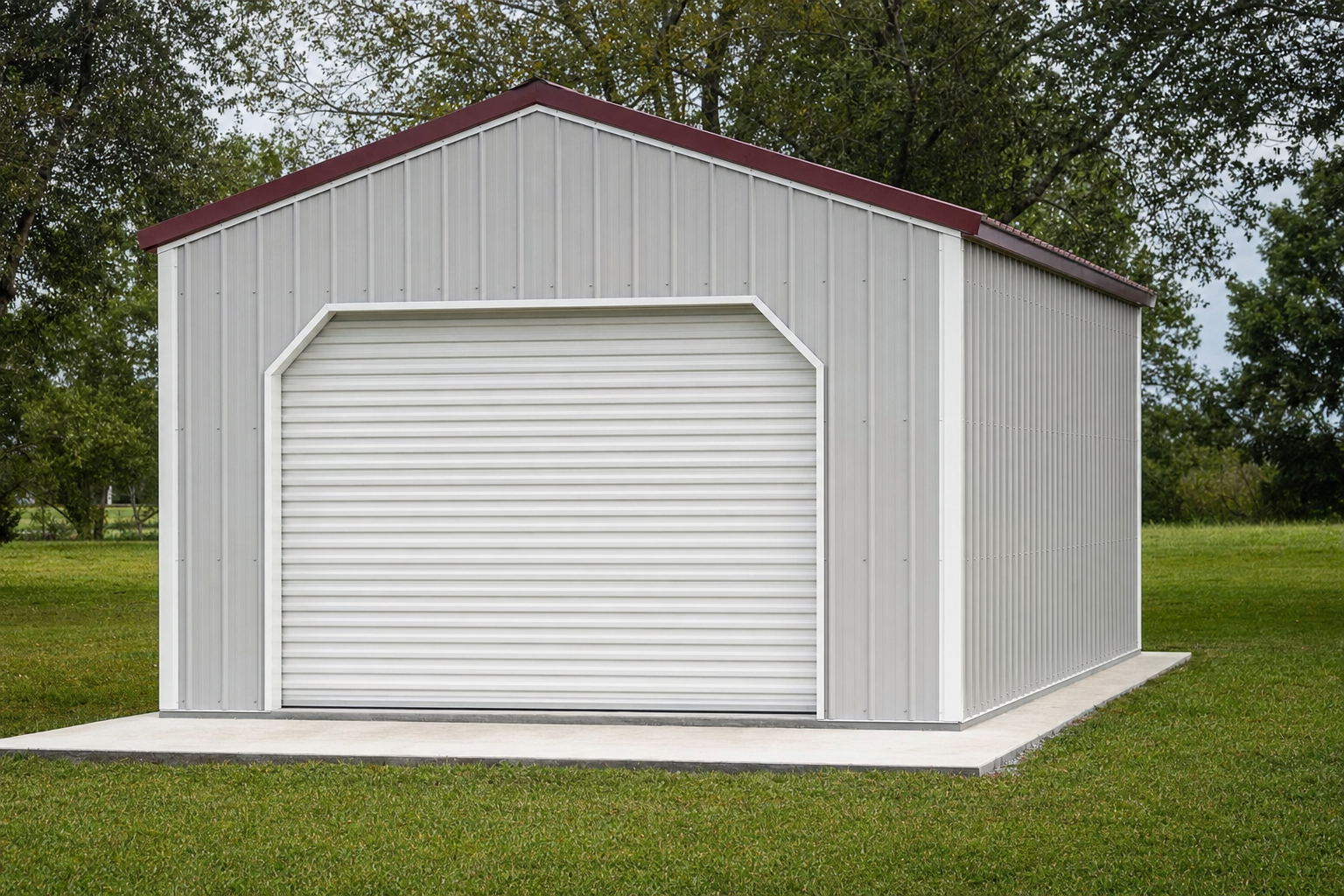 Metal garage building with roll-up door on green lawn