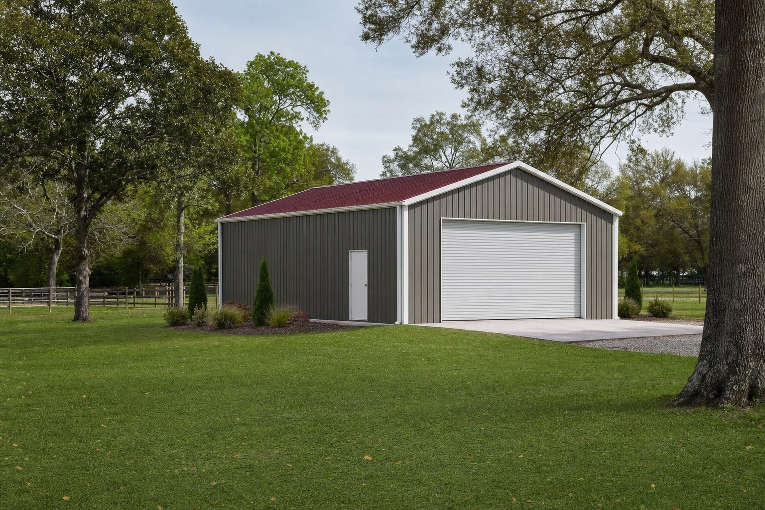 Metal pole barn garage with red roof on green rural property